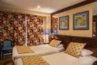 Kira Nile Cruise twin bedroom cabin interior